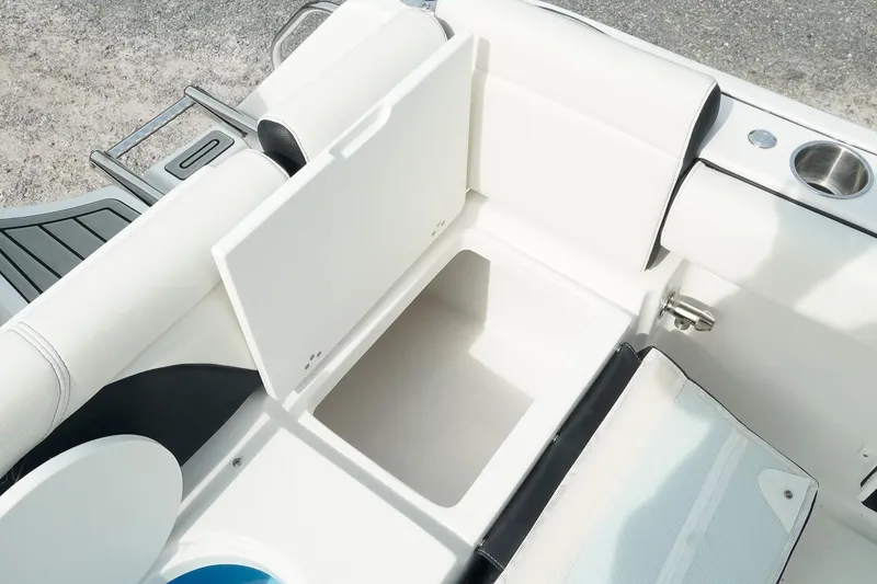 Slide: The Image of 2026 Tidewater 232 LXF boat interior storage compartment with cup holder and seating. - 45