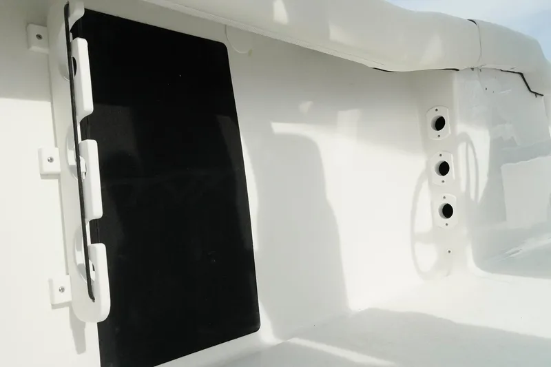 Slide: The Image of Interior view of 2026 Tidewater 232 LXF boat, featuring sleek white design elements. - 47