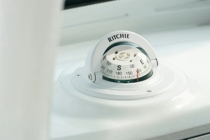 Slide: The Image of Compass on 2026 Tidewater 232 LXF boat, showing southeast direction. - 49