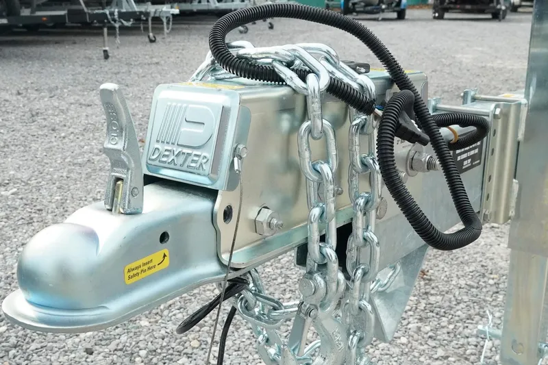 Slide: The Image of Trailer hitch with Dexter branding and safety chains, suitable for Tidewater 232 LXF 2026 model. - 54