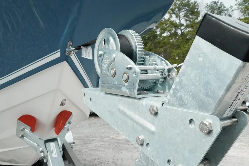 Slide: The Image of 2026 Tidewater 232 LXF boat on trailer with winch mechanism, close-up view. - 55