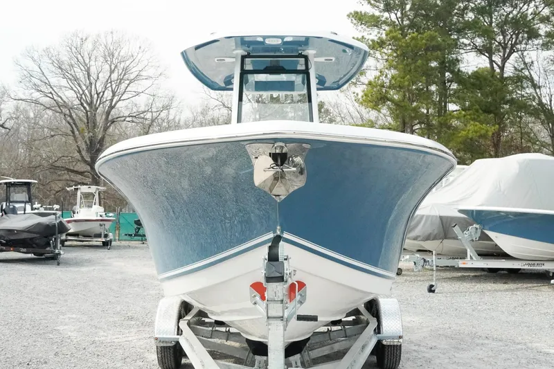 Slide: The Image of 2026 Tidewater 232 LXF boat on trailer, front view, in outdoor setting. - 7