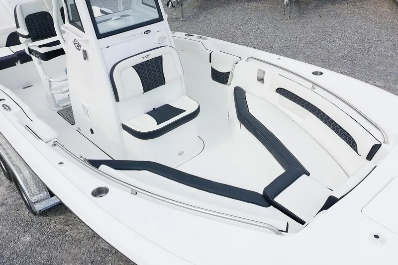 Slide: The Image of 2026 Tidewater 232 LXF boat interior with white and black seating, modern design. - 9