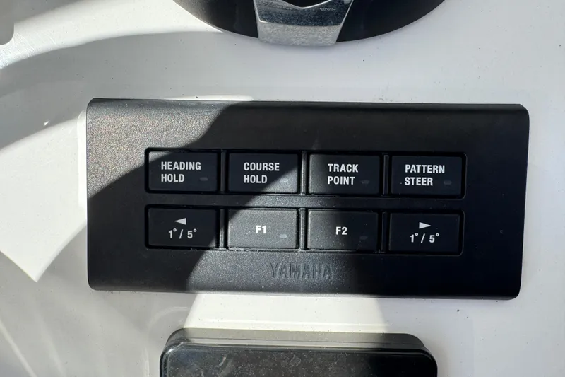 Slide: The Image of Control panel of a 2022 Sea Hunt Gamefish 25 boat with navigation buttons. - 10