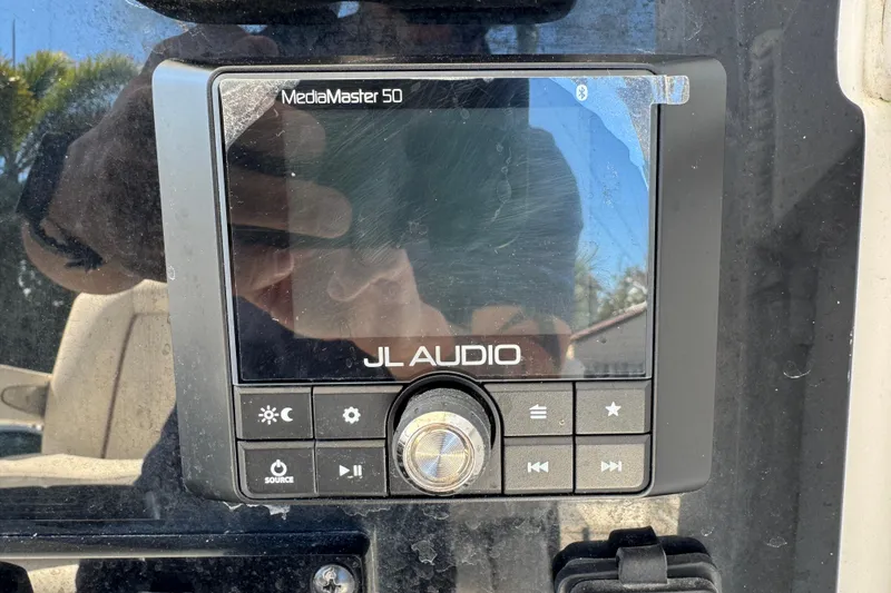 Slide: The Image of JL Audio MediaMaster 50 control panel on 2022 Sea Hunt Gamefish 25 boat. - 14