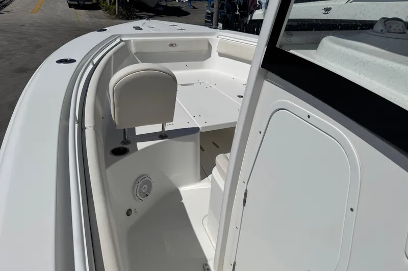 Slide: The Image of 2022 Sea Hunt Gamefish 25 boat interior with seating and storage compartments. - 16