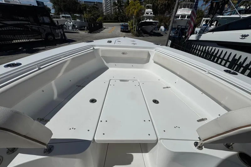 Slide: The Image of 2022 Sea Hunt Gamefish 25 boat interior with spacious seating and storage. - 17