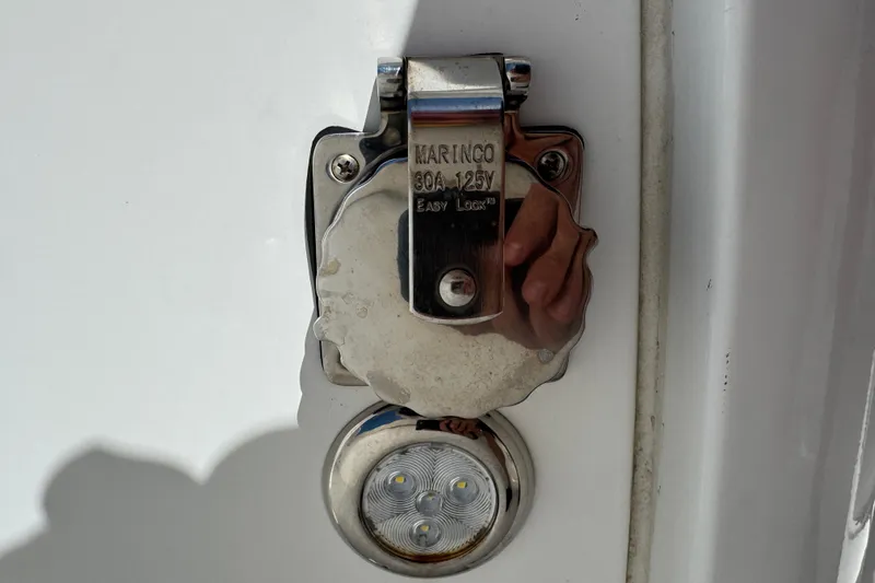 Slide: The Image of Close-up of a Marinco 30A 125V outlet on a 2022 Sea Hunt Gamefish 25 boat. - 21