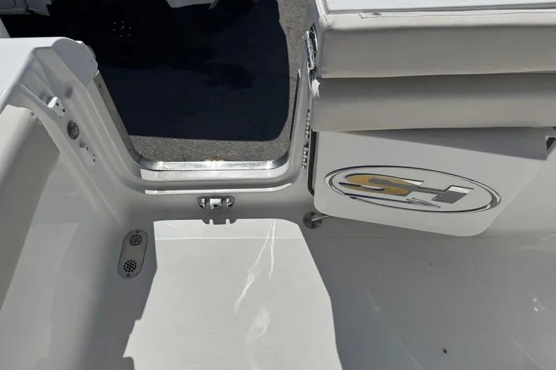 Slide: The Image of 2022 Sea Hunt Gamefish 25 boat interior with logo and seating area. - 26