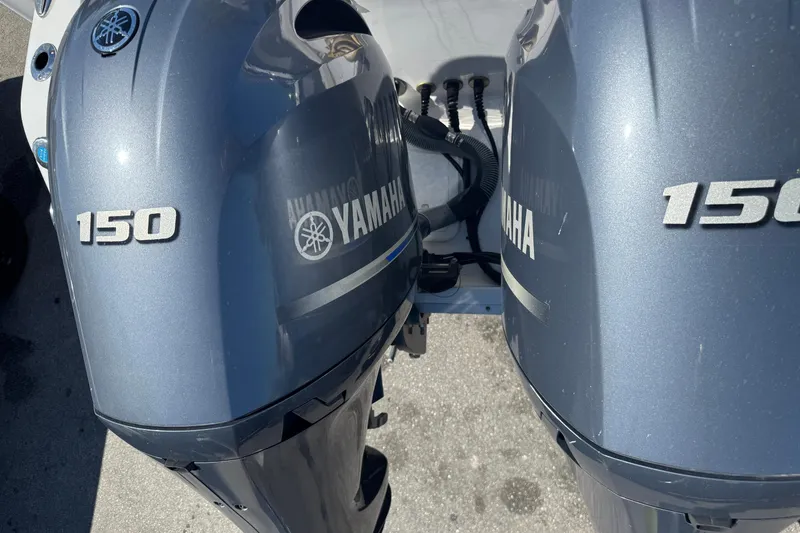 Slide: The Image of Two Yamaha 150 outboard motors on a Sea Hunt Gamefish 25 boat. - 28