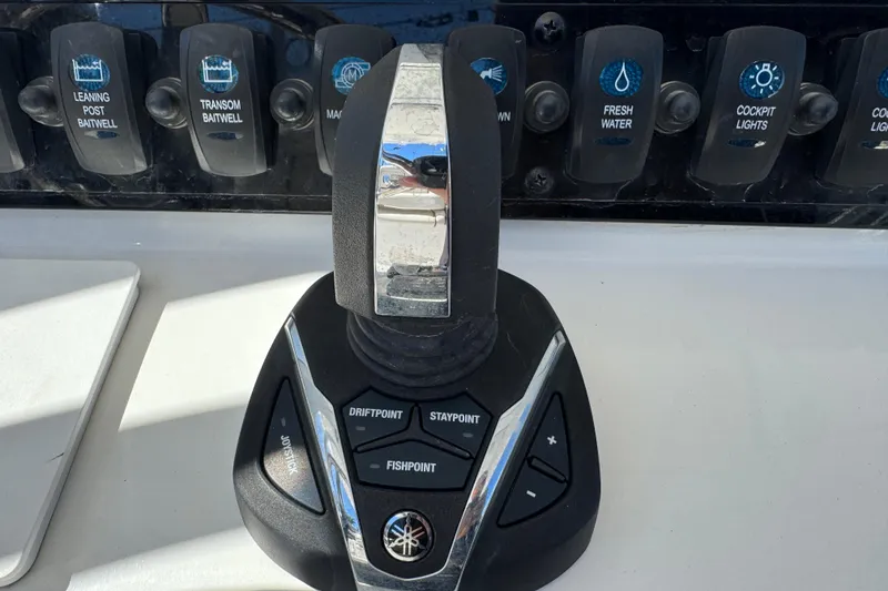 Slide: The Image of Joystick control panel on 2022 Sea Hunt Gamefish 25 boat, featuring various function buttons. - 9