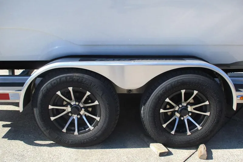 Slide: The Image of 2023 Custom Pathfinder 2500 trailer with dual black alloy wheels on concrete. - 10