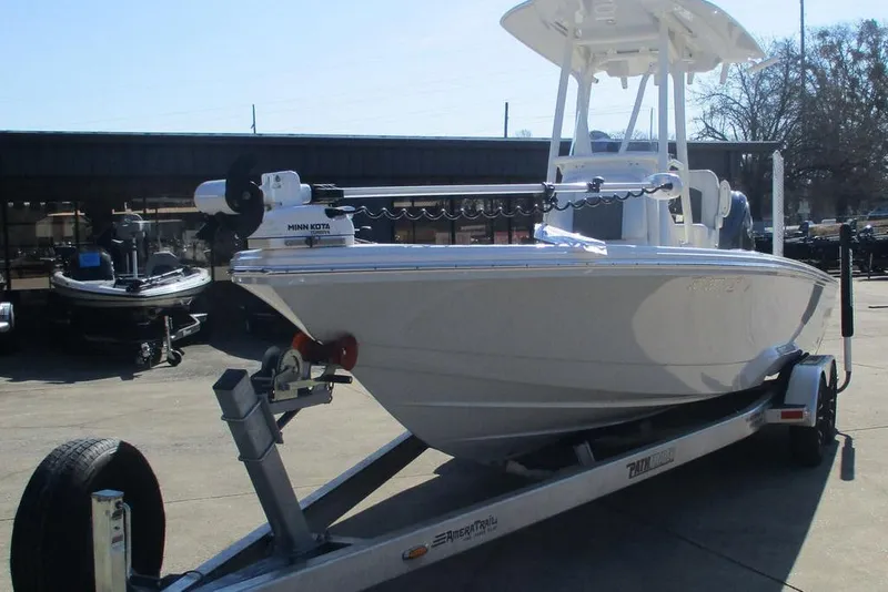 Slide: The Image of 2023 Custom Pathfinder 2500 boat on trailer with Minn Kota motor in a dealership lot. - 11