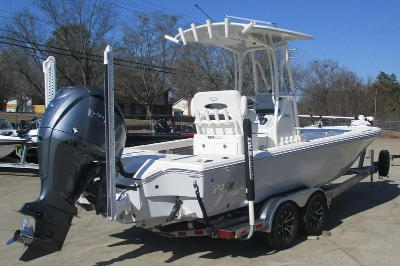 Slide: The Image of 2023 Custom Pathfinder 2500 boat on trailer with Yamaha outboard motor. - 2