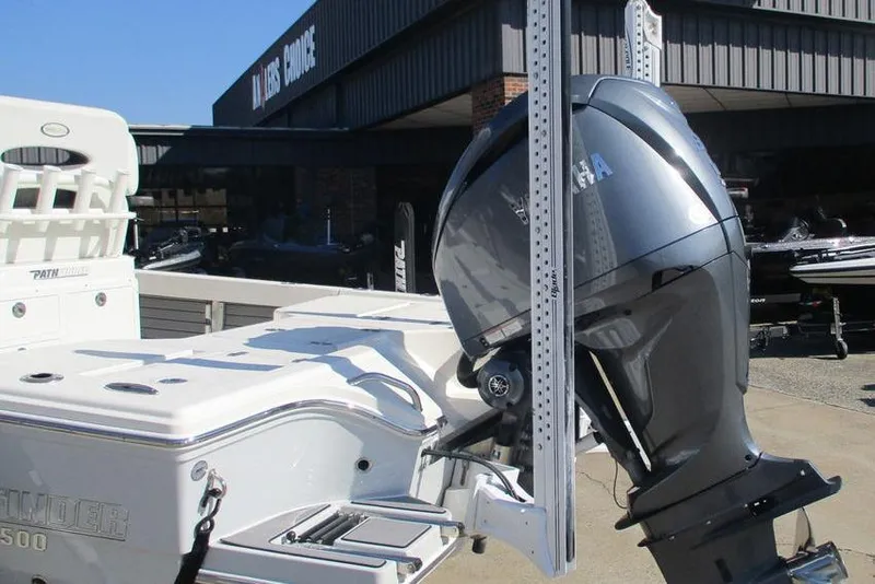 Slide: The Image of 2023 Custom Pathfinder 2500 boat with Yamaha outboard motor at dealership. - 4