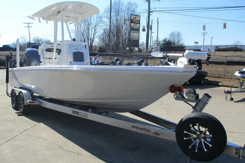 Slide: The Image of 2023 Custom Pathfinder 2500 boat on trailer, parked outdoors in a lot. - 8