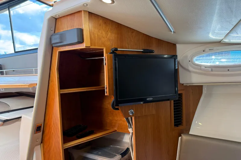 Slide: The Image of Interior of 2022 Cutwater C-32 CB boat with TV and wooden cabinetry. - 16