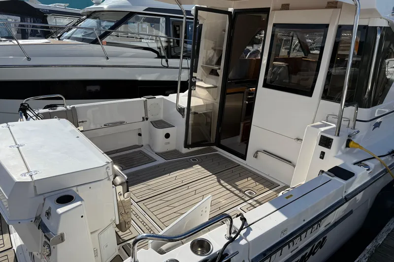 Slide: The Image of 2022 Cutwater C-32 CB boat with open cockpit and modern interior design. - 2