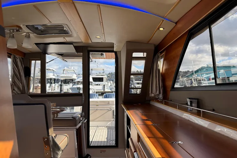 Slide: The Image of Interior of 2022 Cutwater C-32 CB yacht with modern design and marina view. - 20