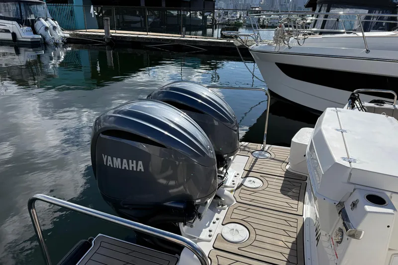 Slide: The Image of 2022 Cutwater C-32 CB with dual Yamaha outboard engines docked at marina. - 3