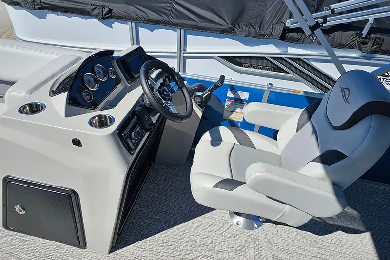 Slide: The Image of 2026 SunCatcher Select 22C boat interior with steering console and captain's chair. - 15