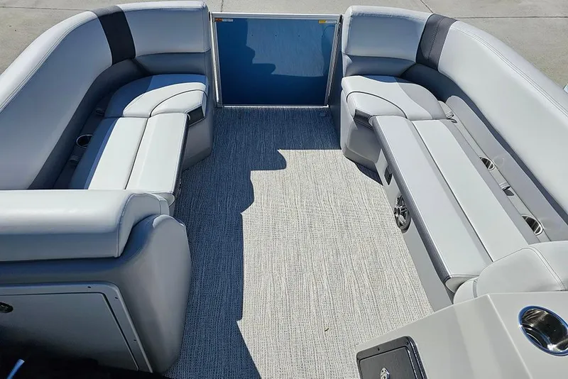 Slide: The Image of Interior of 2026 SunCatcher Select 22C pontoon boat with gray seating and carpet. - 16