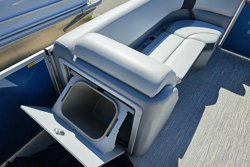 Slide: The Image of SunCatcher Select 22C 2026 boat interior with open storage compartment and cushioned seating. - 17