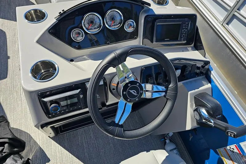 Slide: The Image of Steering console of 2026 SunCatcher Select 22C boat with gauges and controls. - 19