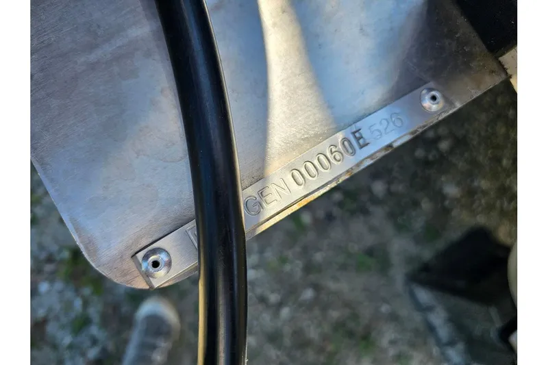 Slide: The Image of Close-up of SunCatcher Select 22C 2026 model serial number plate with cable. - 22