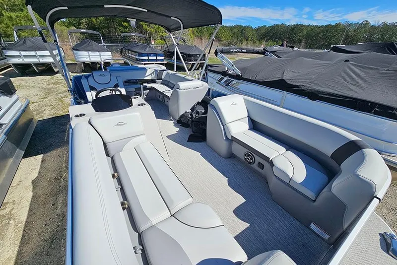 Slide: The Image of 2026 SunCatcher Select 22C pontoon boat with spacious seating and modern design. - 7