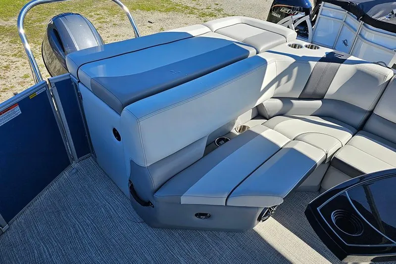 Slide: The Image of 2026 SunCatcher Select 22C pontoon boat interior with plush seating and modern design. - 8
