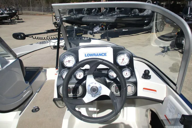 Slide: The Image of 2013 Nitro Z-7 boat dashboard with Lowrance electronics and steering wheel. - 4
