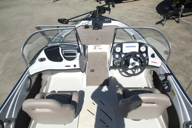 Slide: The Image of 2013 Nitro Z-7 boat interior with steering wheel and dashboard controls. - 9