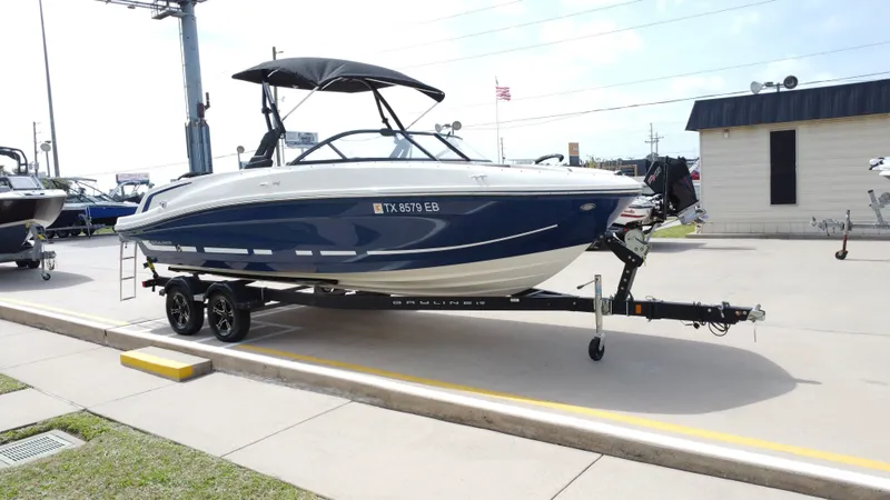 Slide: The Image of 2018 Bayliner VR6 boat in front of pre-owned superstore. - 8