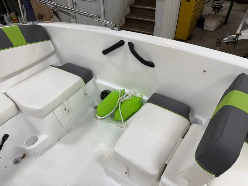 Slide: The Image of Interior of 2024 Tahoe T16 boat with green and gray seating. - 11