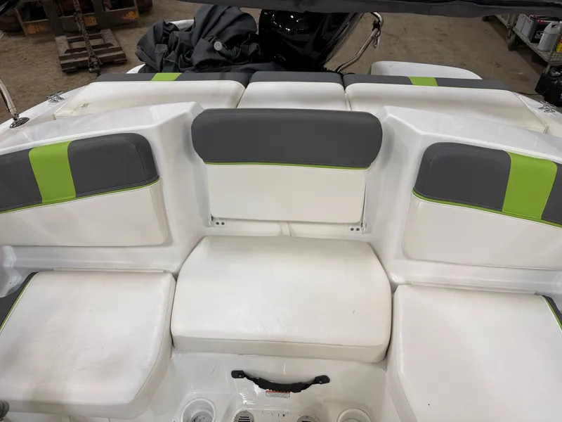 Slide: The Image of Interior of 2024 Tahoe T16 boat with gray and green seating. - 16