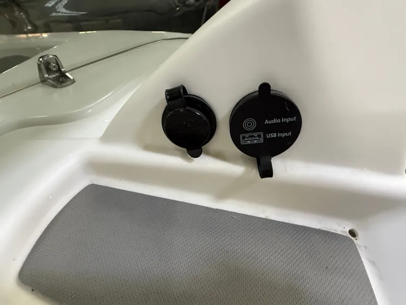 Slide: The Image of 2024 Tahoe T16 audio and USB inputs on white panel. - 17