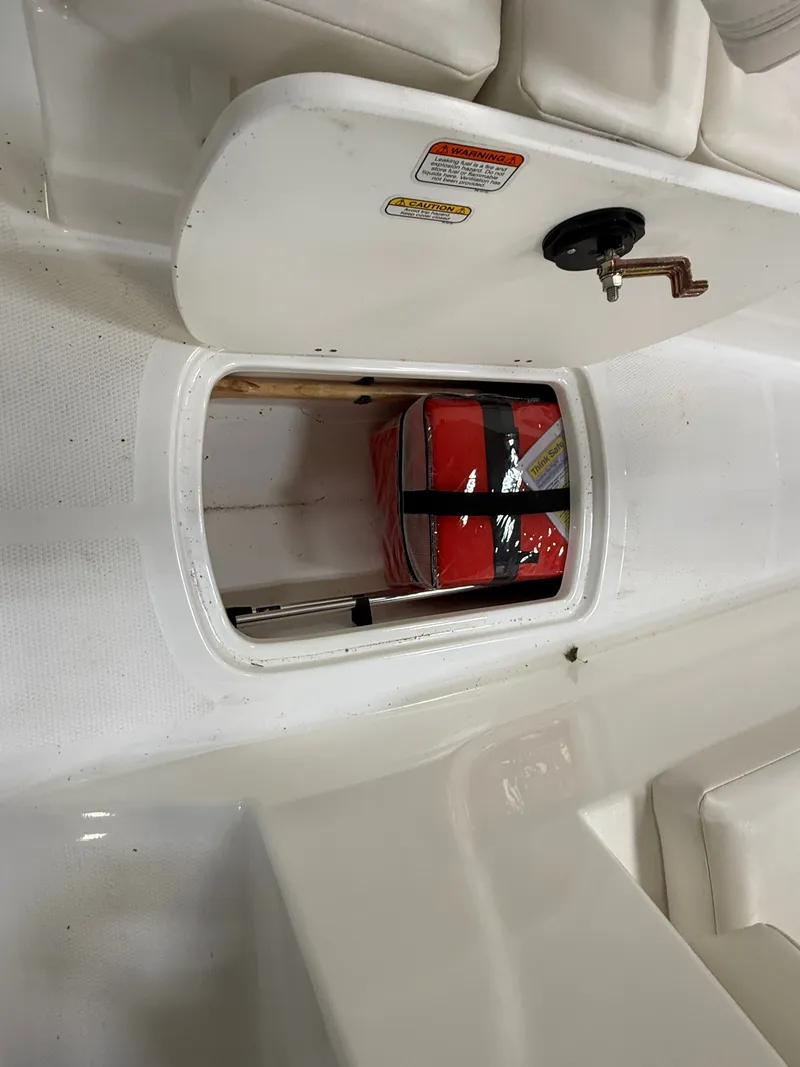 Slide: The Image of 2024 Tahoe T16 boat with storage compartment and safety gear. - 18