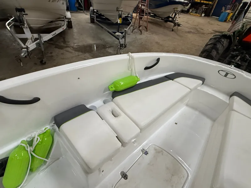 Slide: The Image of Interior of a 2024 Tahoe T16 boat with white seating. - 19