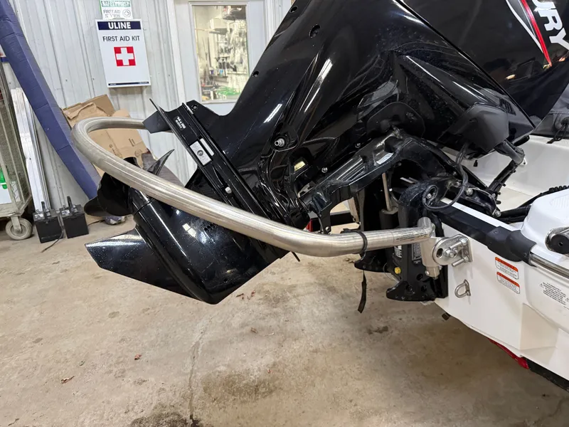 Slide: The Image of 2024 Tahoe T16 outboard motor in workshop setting. - 24