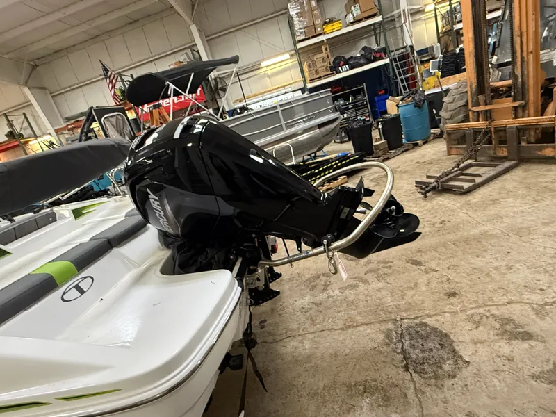 Slide: The Image of 2024 Tahoe T16 boat with outboard motor in warehouse. - 3