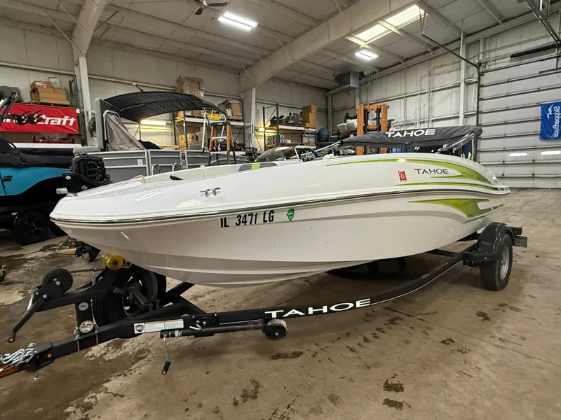 Slide: The Image of 2024 Tahoe T16 boat in warehouse on trailer. - 4