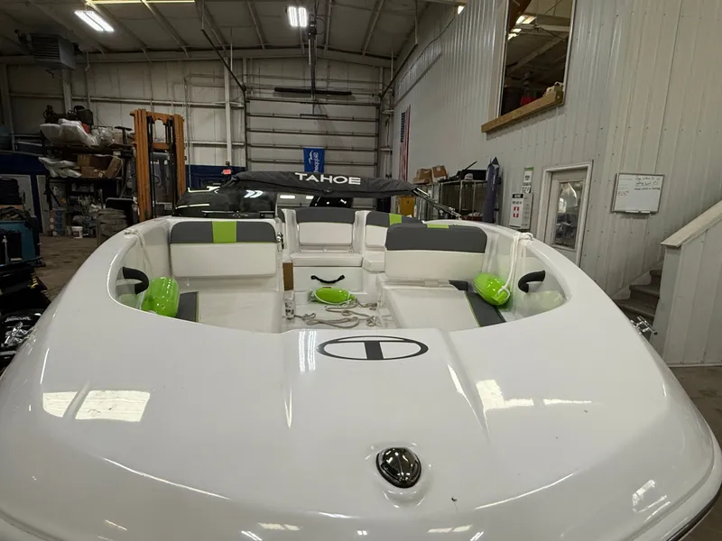 Slide: The Image of 2024 Tahoe T16 boat in warehouse with interior view. - 6