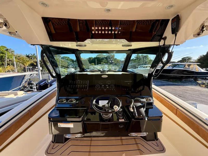 Slide: The Image of Interior view of 2023 Scout 377 LXF boat cockpit. - 1