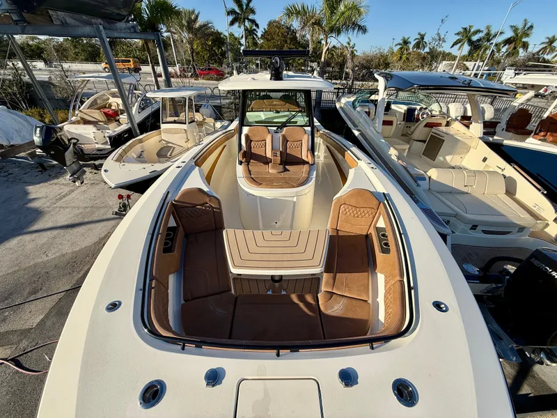 Slide: The Image of Scout 377 LXF 2023 boat with luxurious interior and seating area. - 12