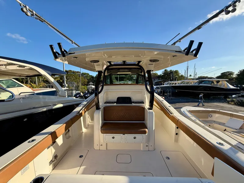 Slide: The Image of Interior view of 2023 Scout 377 LXF boat at dock. - 18