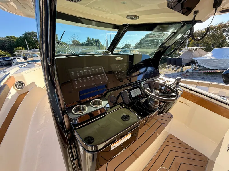 Slide: The Image of Interior view of 2023 Scout 377 LXF boat cockpit. - 2