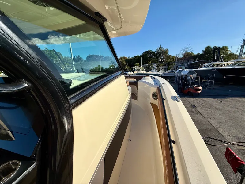 Slide: The Image of Scout 377 LXF 2023 boat, side view at the marina. - 9