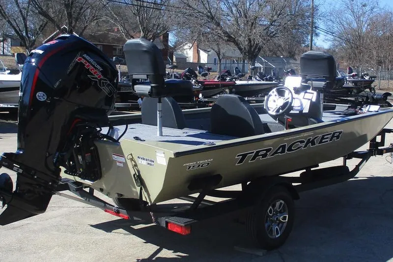Slide: The Image of 2026 Tracker Pro Team 190 boat with Mercury engine on trailer, parked outdoors. - 3
