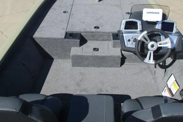 Slide: The Image of 2026 Tracker Pro Team 190 boat interior with steering console and seating. - 5